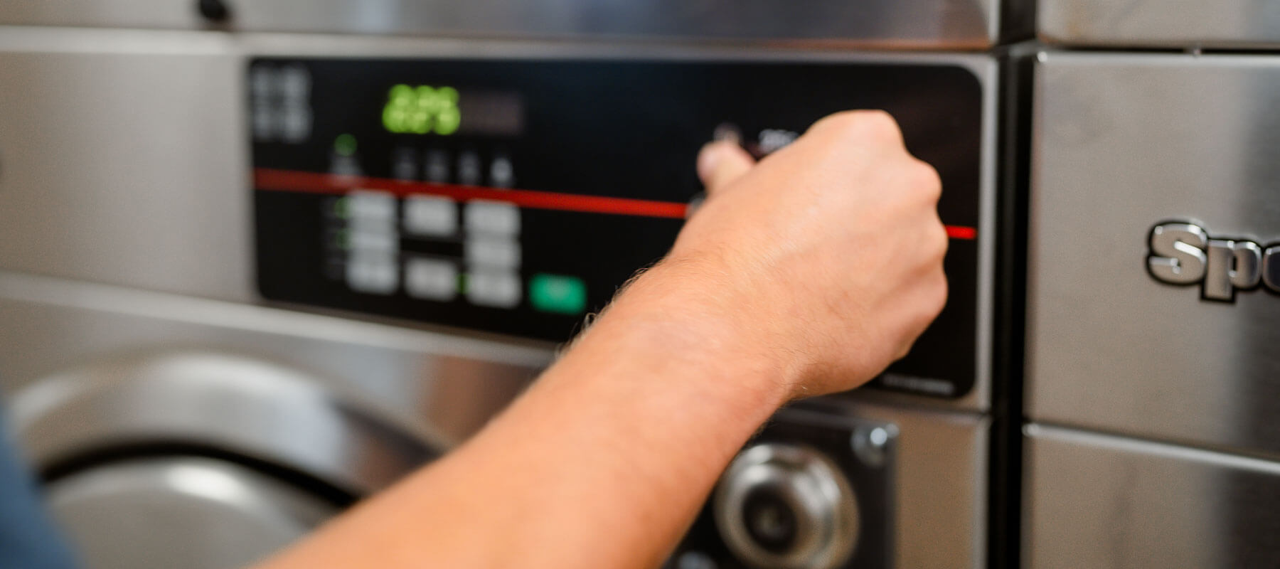 Person Operating Washing Machine